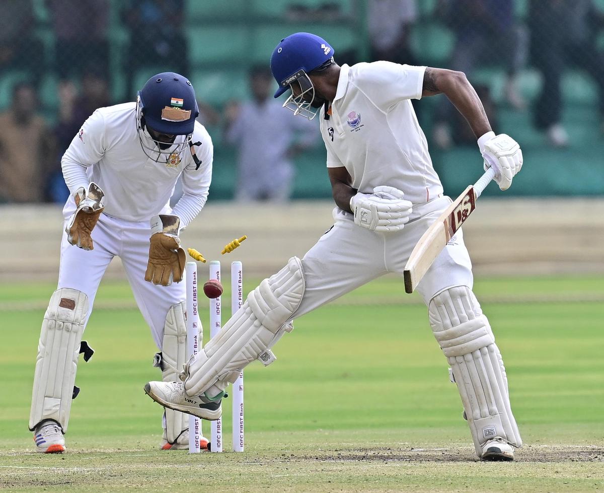 Jammu and Kashmir's captain Paras Dogra vainly tries to stop the ball from dislodging the bails off the bowling of Karnataka's Shreyas Gopal, on the second day of the Ranji Trophy Elite 2025-26 final at the KSCA Rajnagar Stadium in Hubballi, on February 25, 2026.