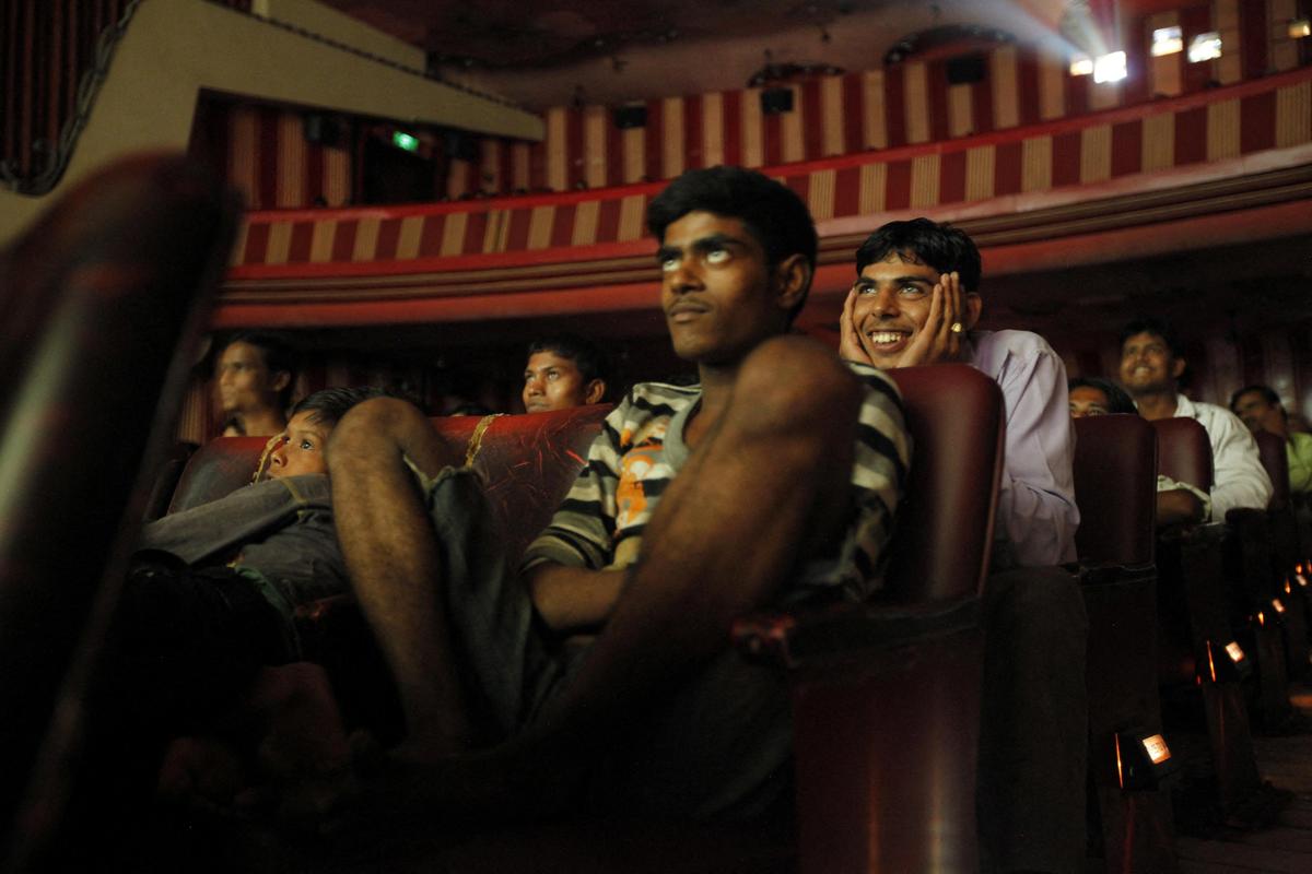 FILE: Cinema goers watch the Bollywood movie 'Dilwale Dulhania Le Jayenge' (The Big Hearted Will Take the Bride), starring actor Shah Rukh Khan, inside Maratha Mandir theatre in Mumbai, July 11, 2010.