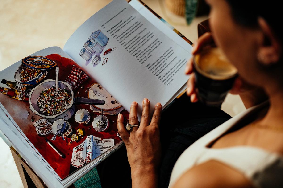 The cookbook features beautiful artwork by Zainab Tambawala.