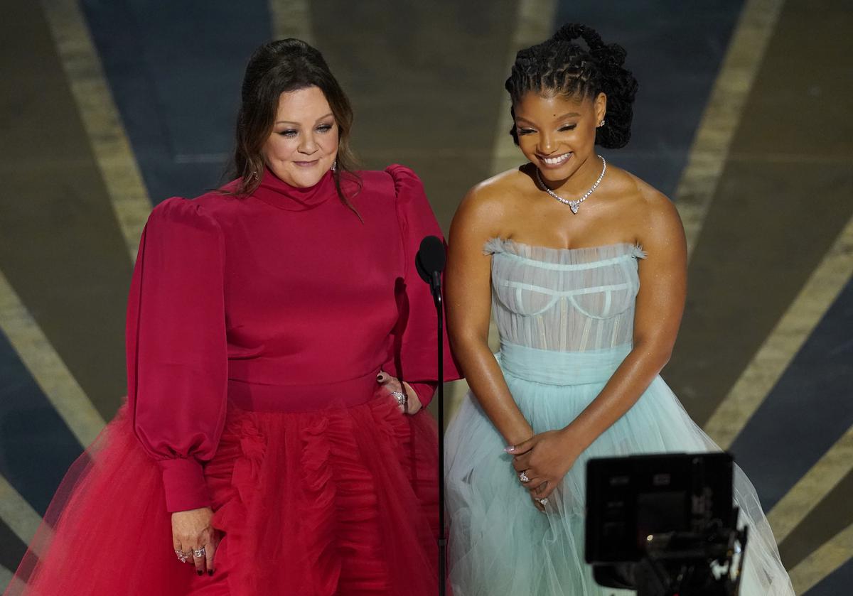 Melissa McCarthy, left, and Halle Bailey speak about “The Little Mermaid” at the Oscars on Sunday, March 12, 2023, at the Dolby Theatre in Los Angeles