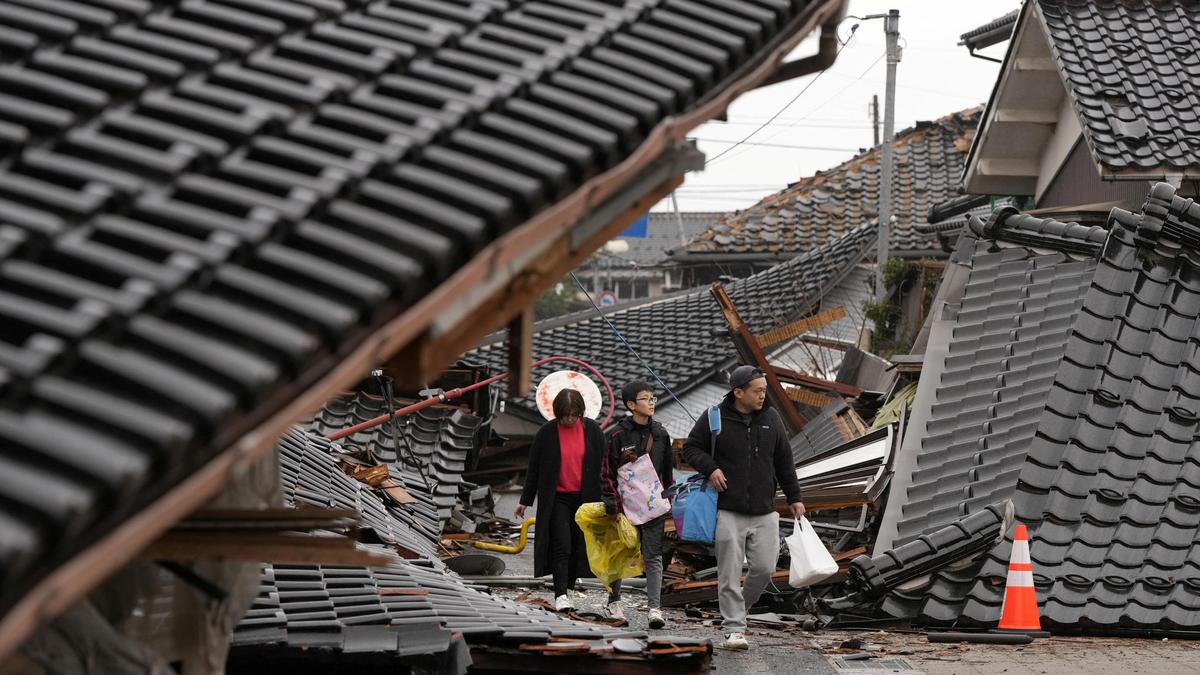 Rescuers race against time in search for survivors in Japan after powerful quakes leave 62 dead