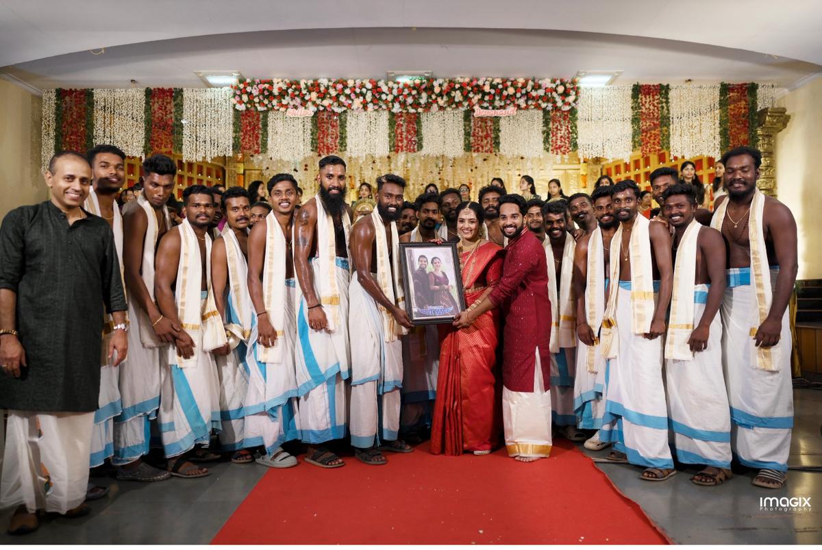 Shilpa Sreekumar and  Devanand Chelot with the Ponnan’s Blue Magic percussion team 