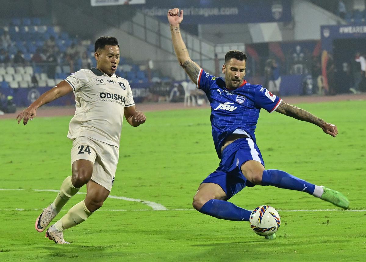 BFC’s Edgar Antonio Mendez scores BFC’s opener during the Indian Super League football match against Odisha FC, at the Sree Kanteerava Stadium, in Bengaluru on January 22, 2025.