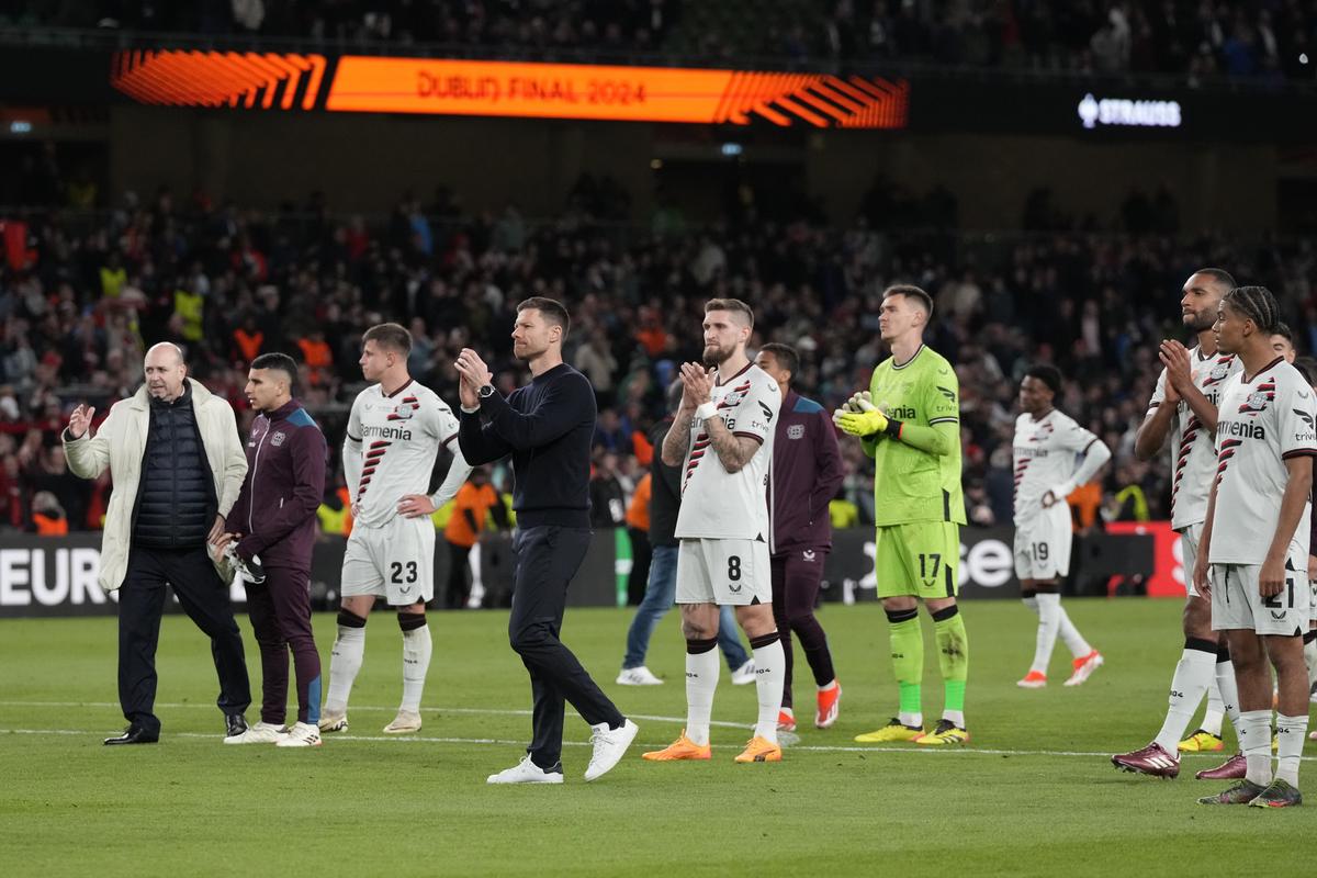 Leverkusen’s head coach Xabi Alonso and his players applaud fans at the end of the Europa League final against Atalanta at the Aviva Stadium in Dublin, Ireland, on May 23, 2024. 