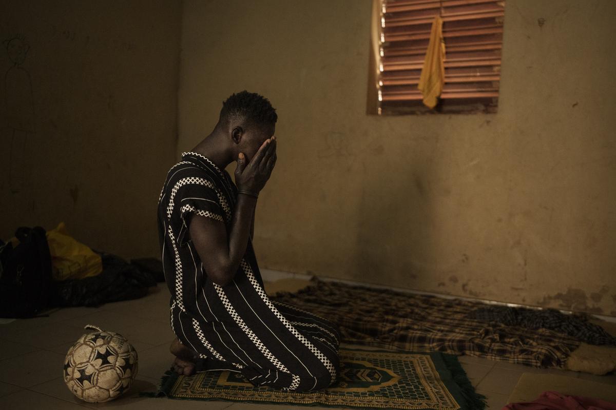 Papa Dieye, 19, prays in his father’s home in Diogo, Senegal. Papa Dieye, 19, prays in his father’s home in Diogo, Senegal.