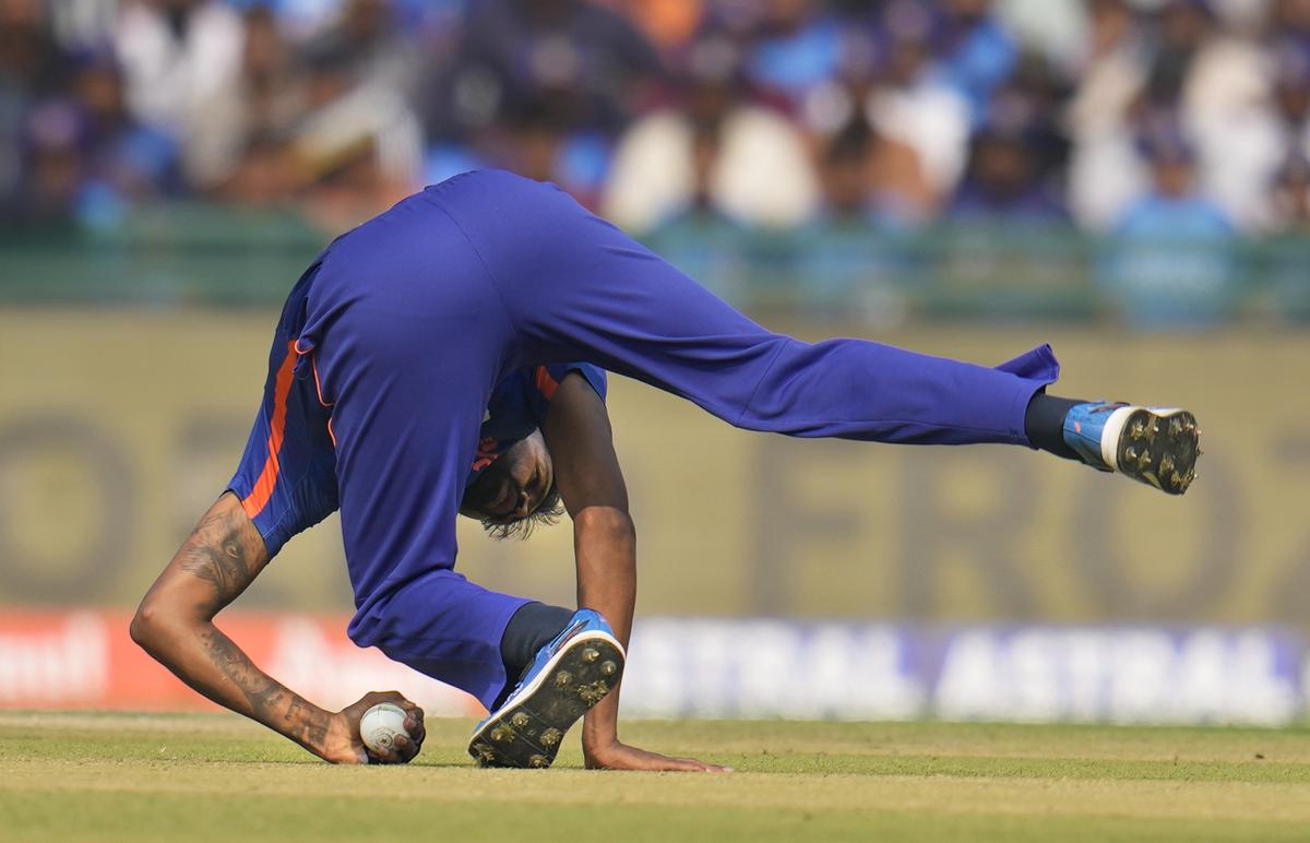 Brilliant reflexes: Hardik Pandya takes a stunning catch on his follow-through to dismiss Devon Conway.