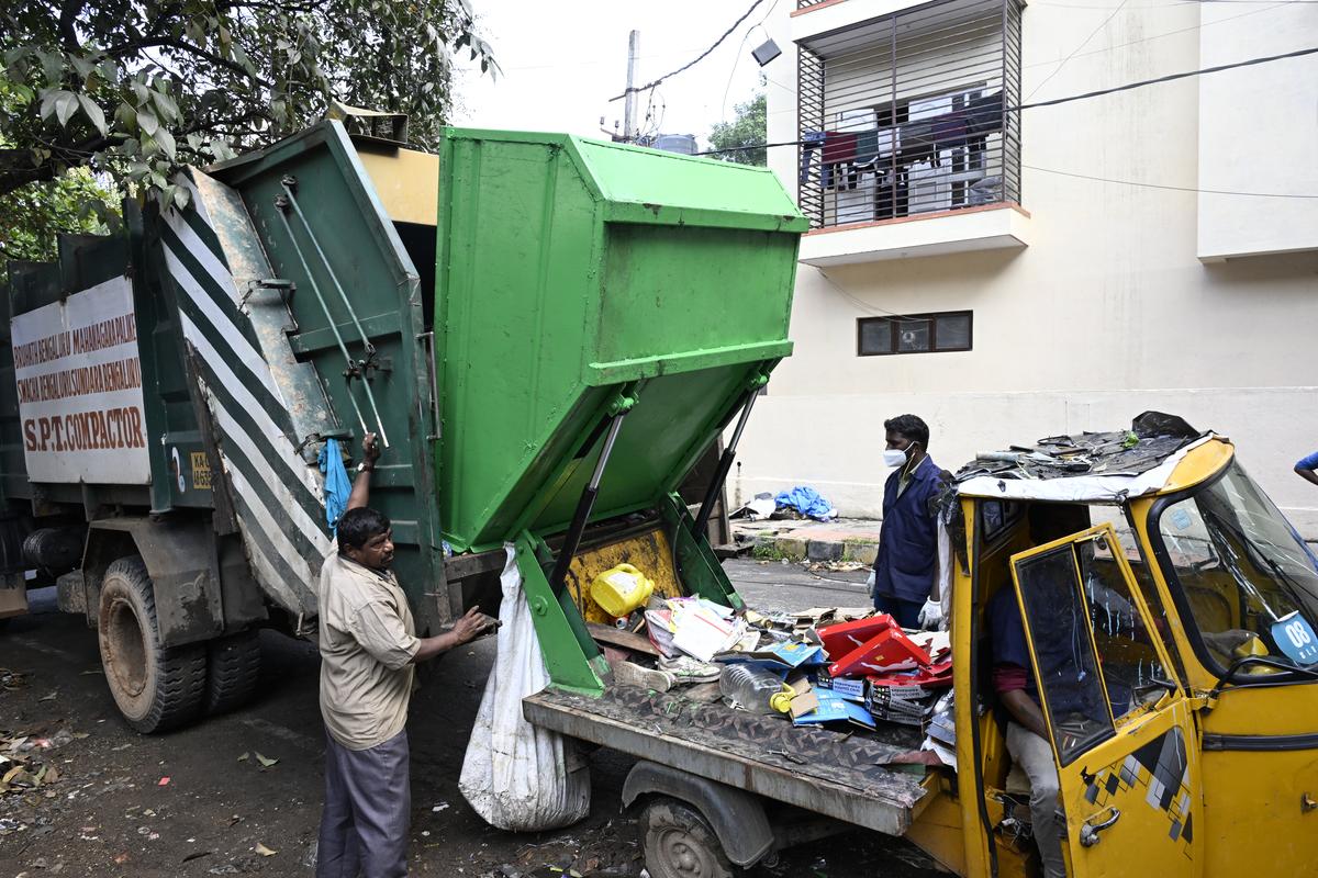 Garbage being shifted from tipper to a compator in Bengaluru.