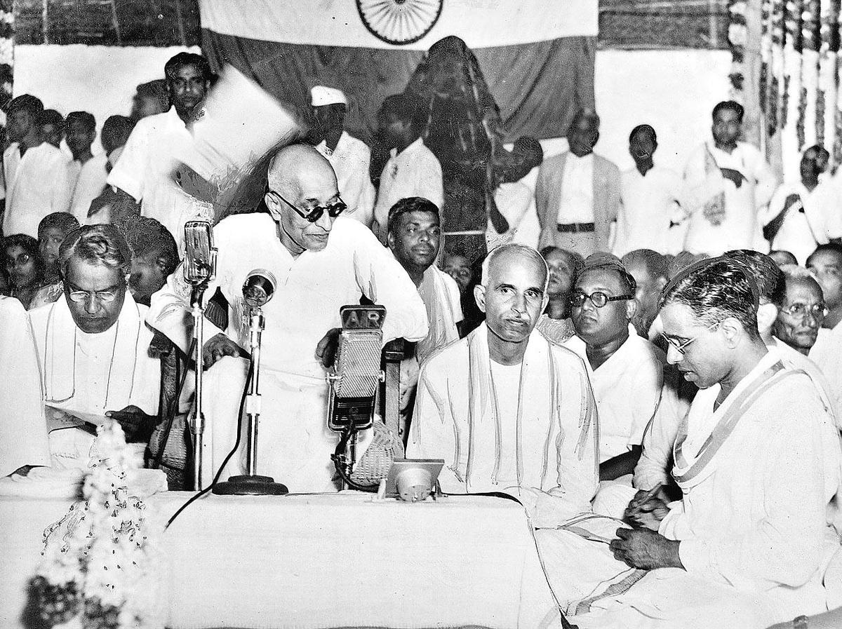 A photograph taken at the opening ceremony of the Bharathi Memorial at Ettaiapuram, the birthplace of Subramania Bharati. C. Rajagopalachari is addressing the gathering. Also seen are Somayajulu, the Secretary of the Reception Committee, Raja of Ettaiapuram, the Chairman of the Reception Committee, and Kalki