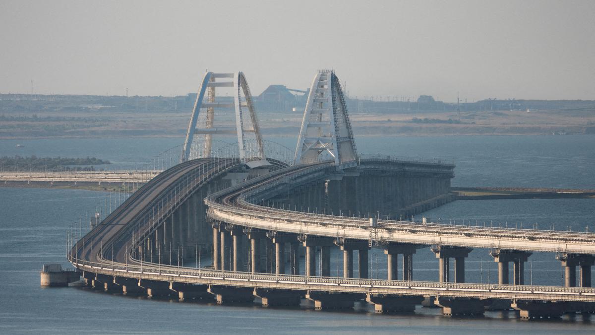 Traffic on key bridge from Crimea to Russia's mainland halted amid reports of explosions and deaths