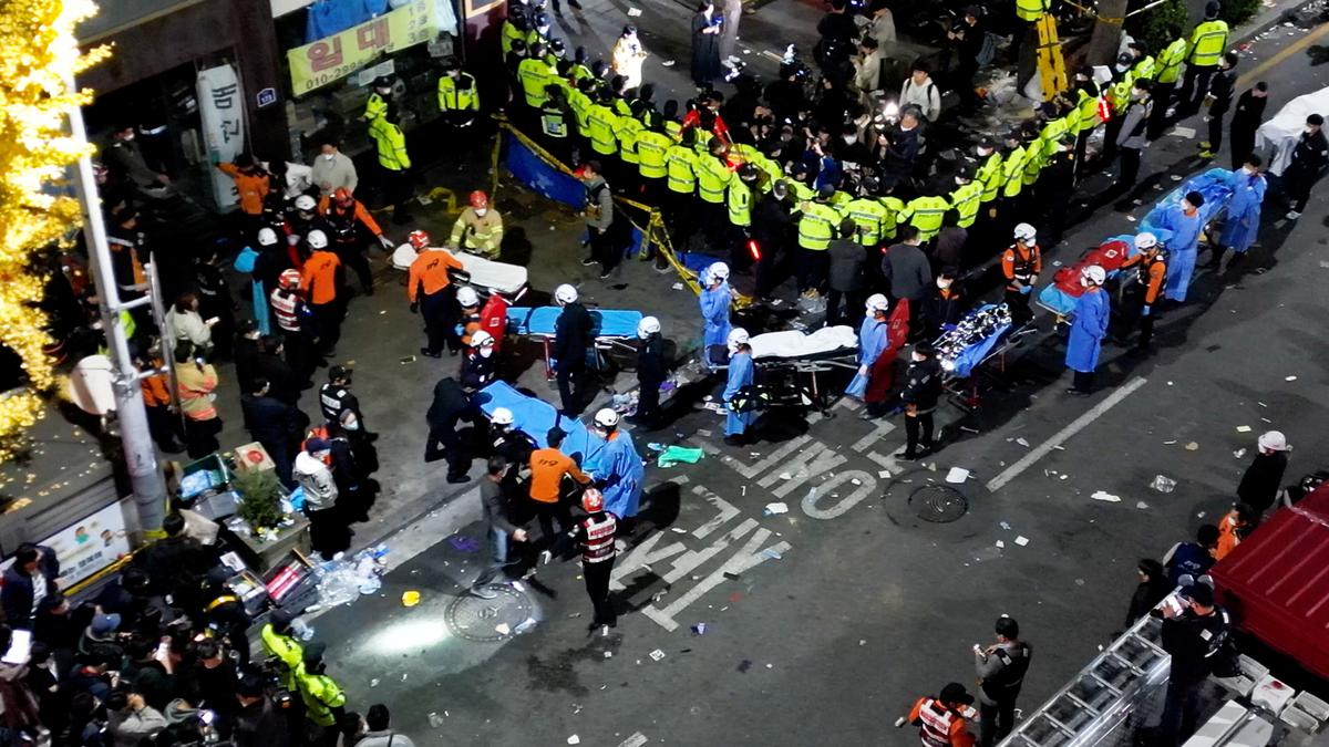 Rescue workers work at the scene where a stampede during Halloween festivities killed an injured many people at the popular Itaewon district in Seoul, South Korea on October 30, 2022.