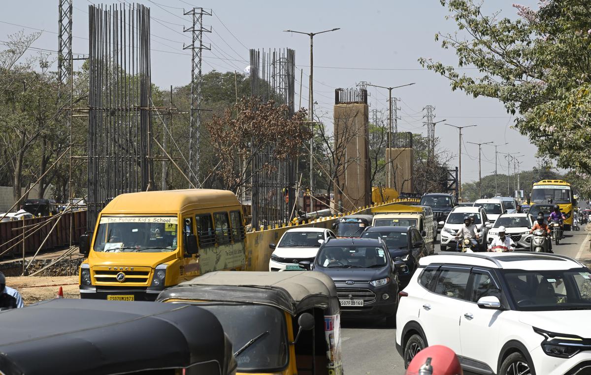 Construction of multi-level flyovers progresses on the busy IIIT Road near the Gachibowli junction in Hyderabad on Friday.