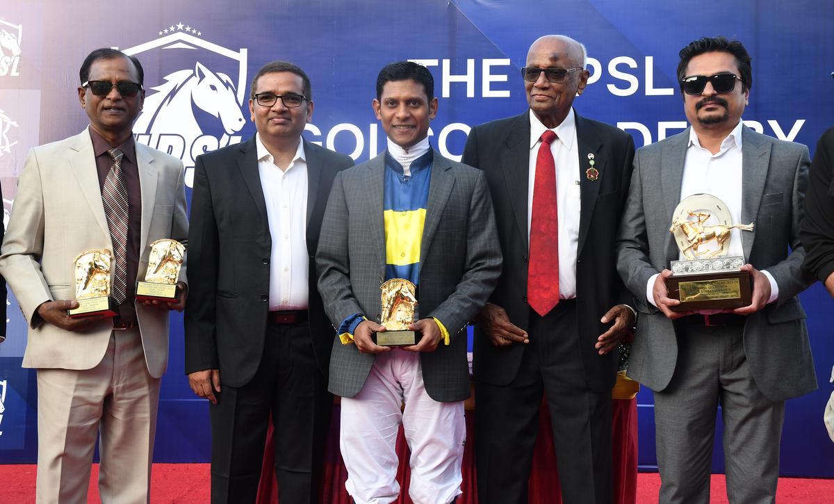 HRC chairman R. Surender Reddy, second from right, and HPSL’s chairman and MD Suresh Paladugu, second from left, with Champions Way owner Teja Gollapudi, right, trainer S. Narredu, left, and jockey Suraj Narredu.