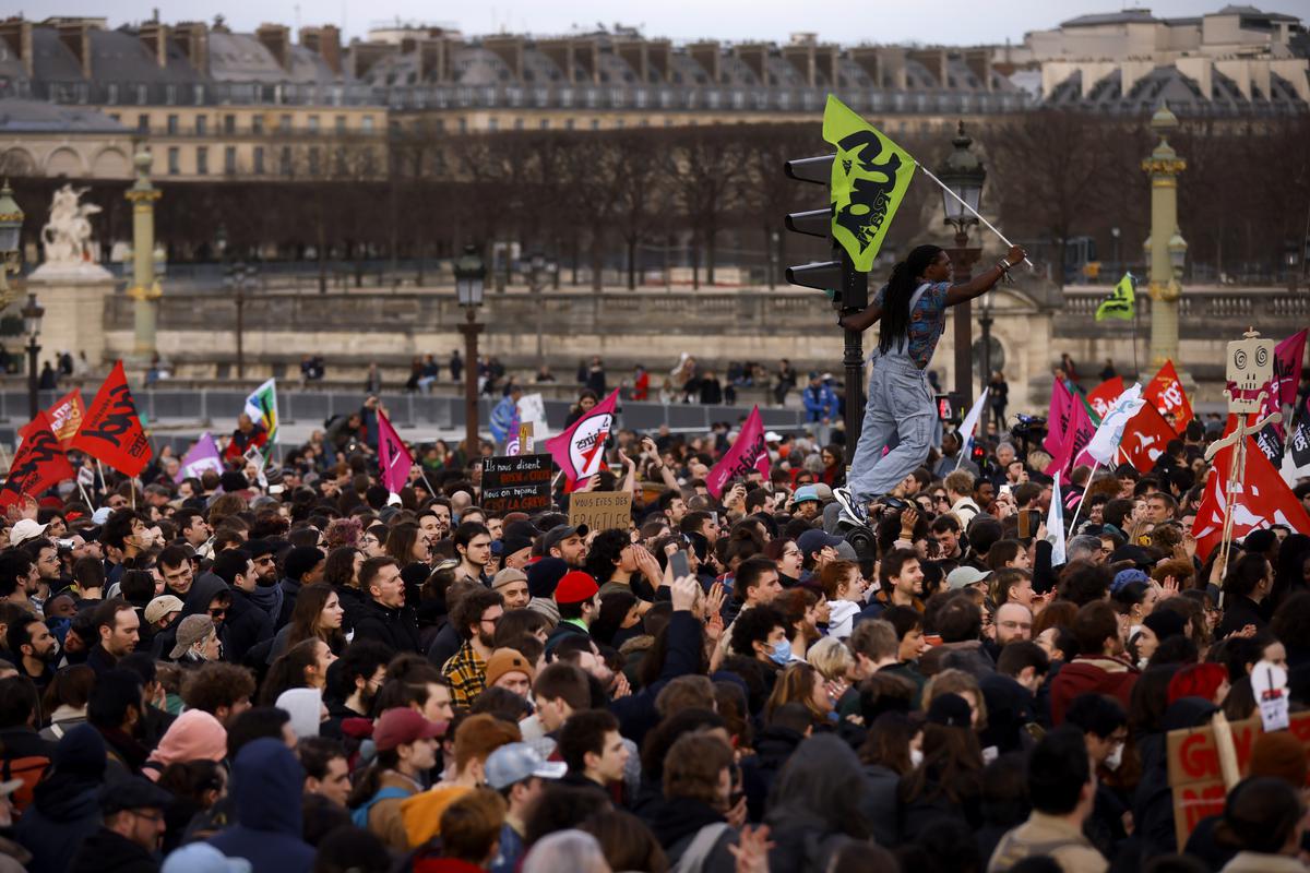 Protesters gather at Concorde square near the National Assembly in Paris, Thursday, March 16, 2023. 