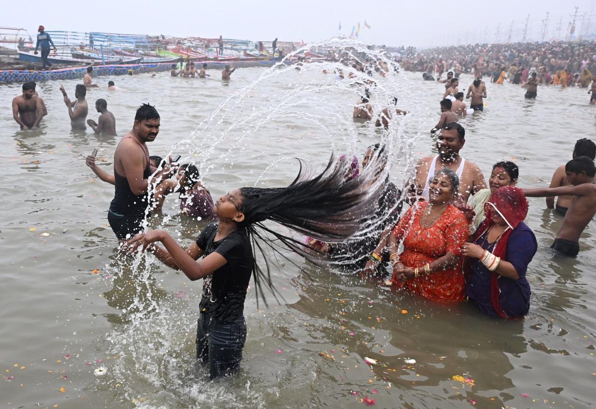 Devotees take dip as Maha Kumbh and people taking images