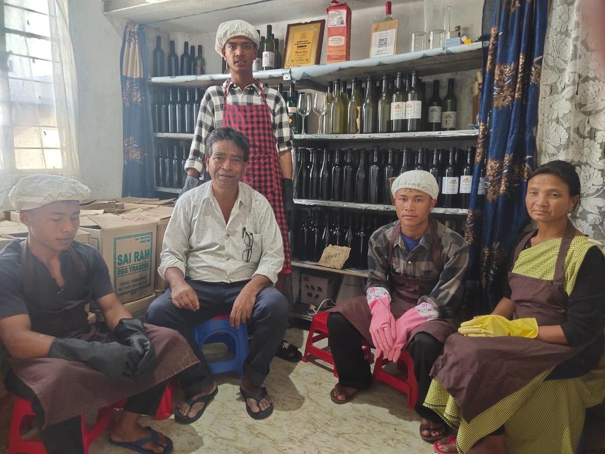 Farmer Bording Ioannis Shylla (in white) at his winemaking unit in at Mawkyrwat.