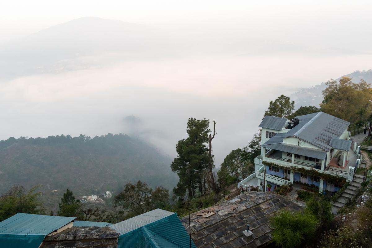 A vintage bungalow on the side of a hill in Kumaon.