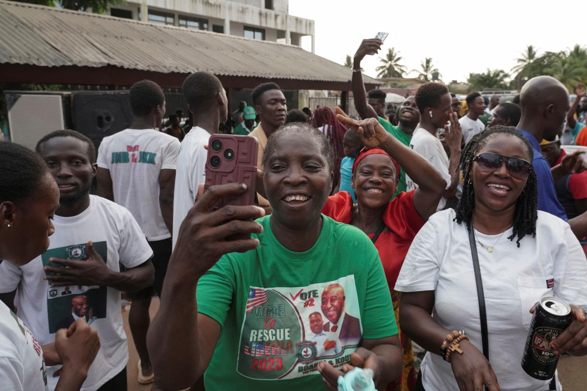 Supporters of Liberia’s opposition Unity Party celebrate after Liberia President George Weah concedes election defeat to Joseph Boakai in Monrovia.