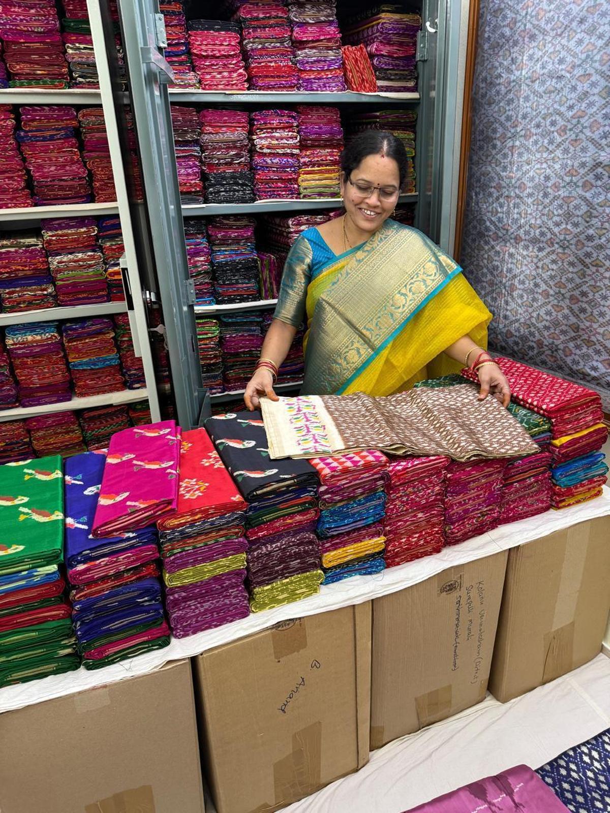 Displaying a collection of saris Displaying a collection of saris