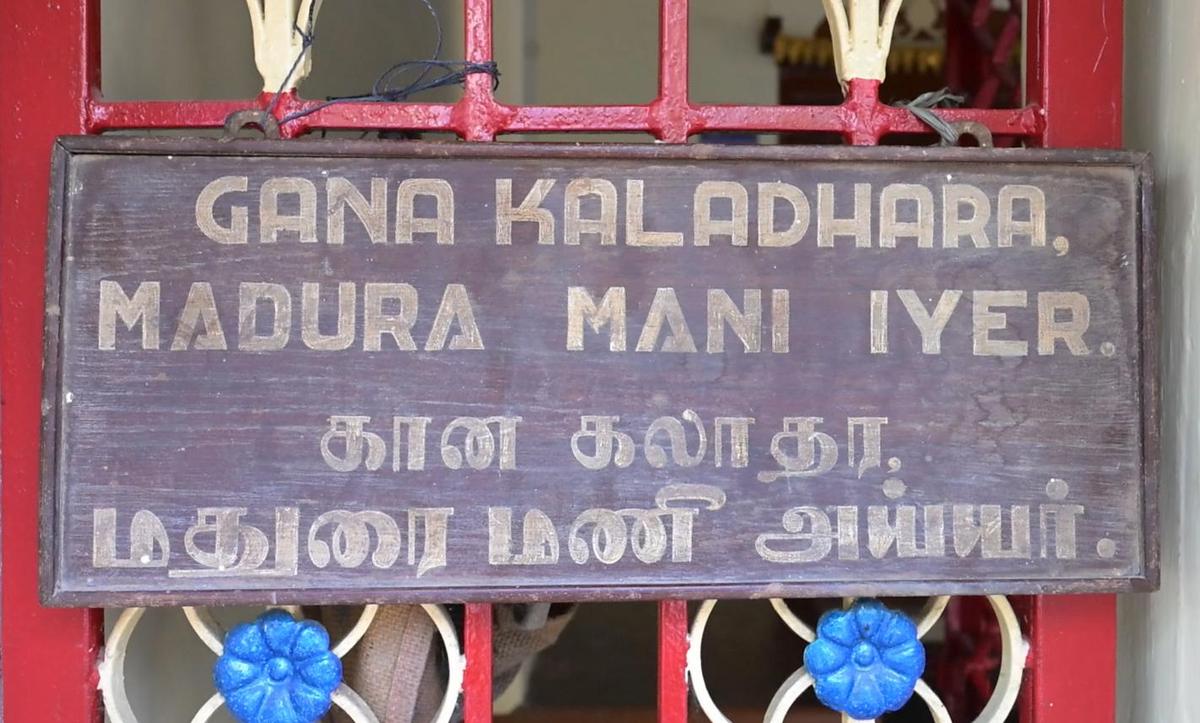 A wooden board, still preserved in the house, bears the name of the former occupant in Tamil and English: Gana  Kaladhara ‘Madurai’ Mani Iyer. 