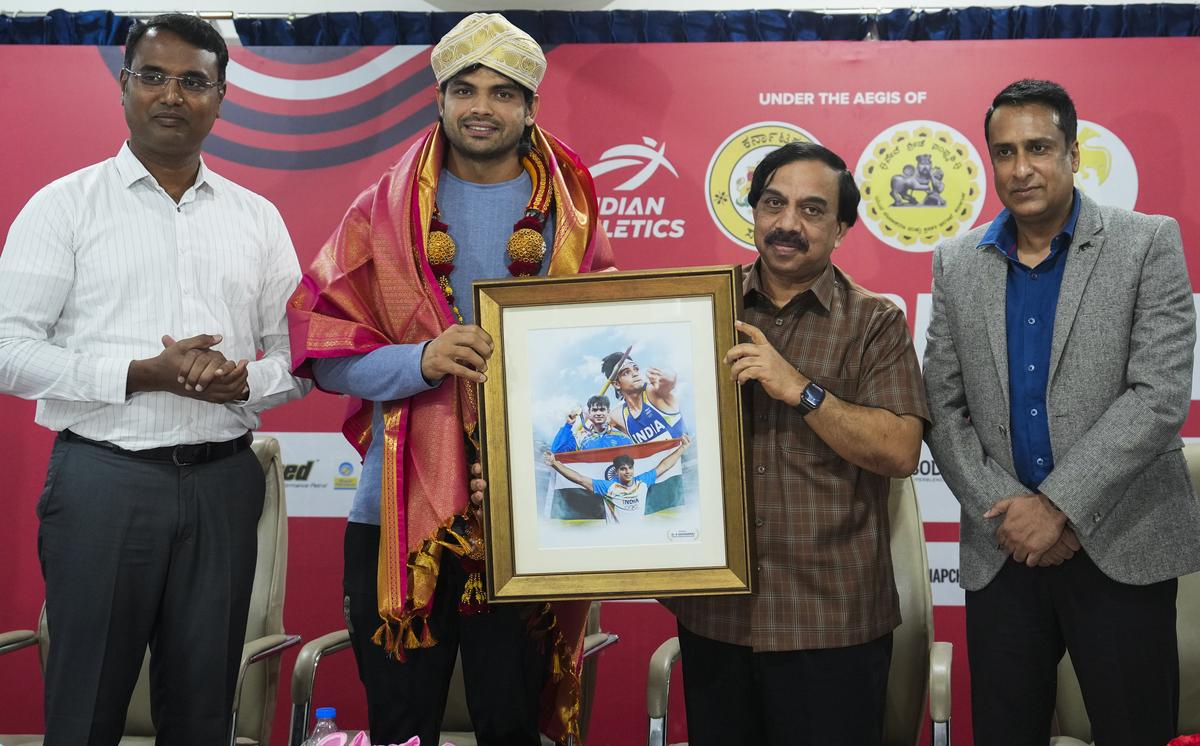 Two-time Olympic medallist Neeraj Chopra being felicitated by Karnataka Olympic Association president K. Govindaraj during a press conference ahead of India’s inaugural international Javelin tournament, Neeraj Chopra Classic 2025, at Kanteerava Stadium in Bengaluru. Two-time Olympic medallist Neeraj Chopra being felicitated by Karnataka Olympic Association president K. Govindaraj during a press conference ahead of India’s inaugural international Javelin tournament, Neeraj Chopra Classic 2025, at Kanteerava Stadium in Bengaluru.