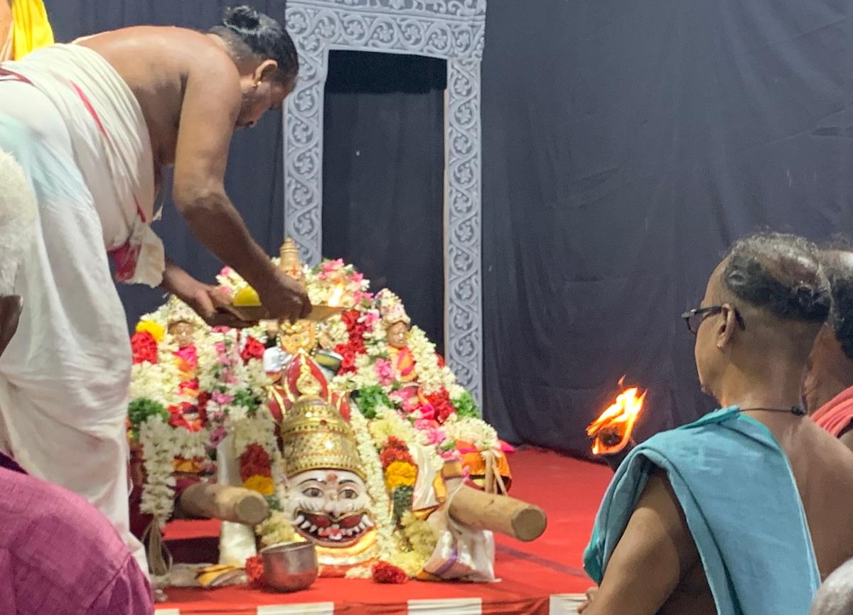 A special puja is performed to Narasimha and his consorts and the mask, an important prop used in Prahlada Charitam. After the preliminary rituals on the inaugural day of the 83rd Bhagavata Mela, the deity is carried back to the temple to the accompaniment of thavil performance.