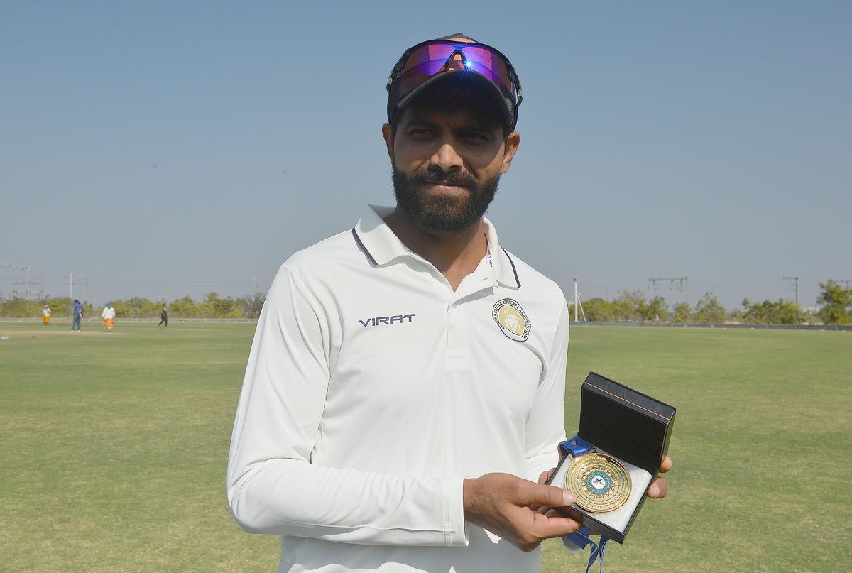 Saurashtra’s Ravindra Jadeja shows his Player of The Match award after the Ranji Trophy match against Delhi at the Niranjan Shah Stadium in Rajkot on Friday, January 24, 2025. 