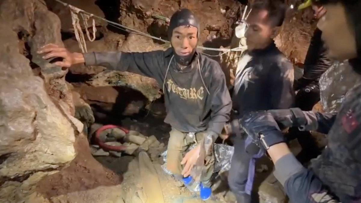 Rescuers search for alternative route to reach two missing in flooded Laos cave