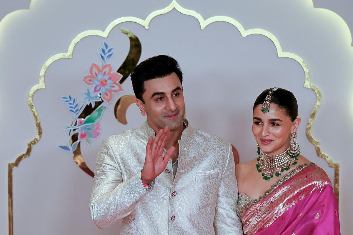 Bollywood actor Ranbir Kapoor (L) with his wife and actress Alia Bhatt pose for photos as they arrive to attend the wedding ceremony of billionaire tycoon and Chairman of Reliance Industries Mukesh Ambani’s son Anant Ambani and Radhika Merchant in Mumbai on July 12, 2024. Socialite sisters Kim and Khloe Kardashian were among the global celebrities spotted in India on July 12 to attend a lavish three-day wedding ceremony staged by Asia’s richest man Mukesh Ambani Bollywood actor Ranbir Kapoor (L) with his wife and actress Alia Bhatt pose for photos as they arrive to attend the wedding ceremony of billionaire tycoon and Chairman of Reliance Industries Mukesh Ambani’s son Anant Ambani and Radhika Merchant in Mumbai on July 12, 2024. Socialite sisters Kim and Khloe Kardashian were among the global celebrities spotted in India on July 12 to attend a lavish three-day wedding ceremony staged by Asia’s richest man Mukesh Ambani