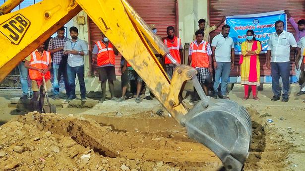 Corporation removes roadside sand at night