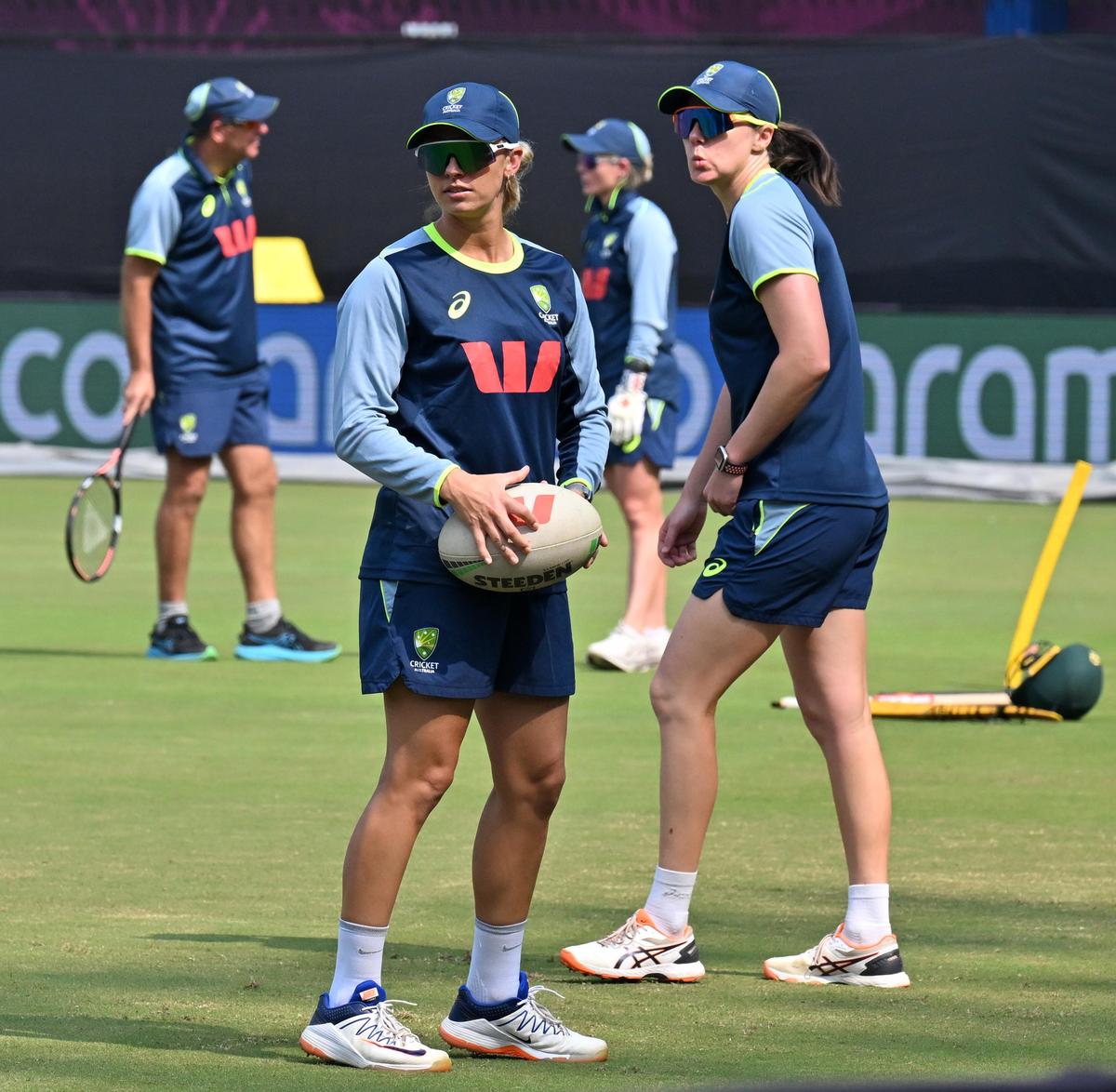 Ashleigh Gardner, left, and Tahlia McGrath during a practice session ahead of the World Cup match between Australia and England at the Holkar Cricket Stadium in Indore, Madhya Pradesh on Tuesday, October 21, 2025.  