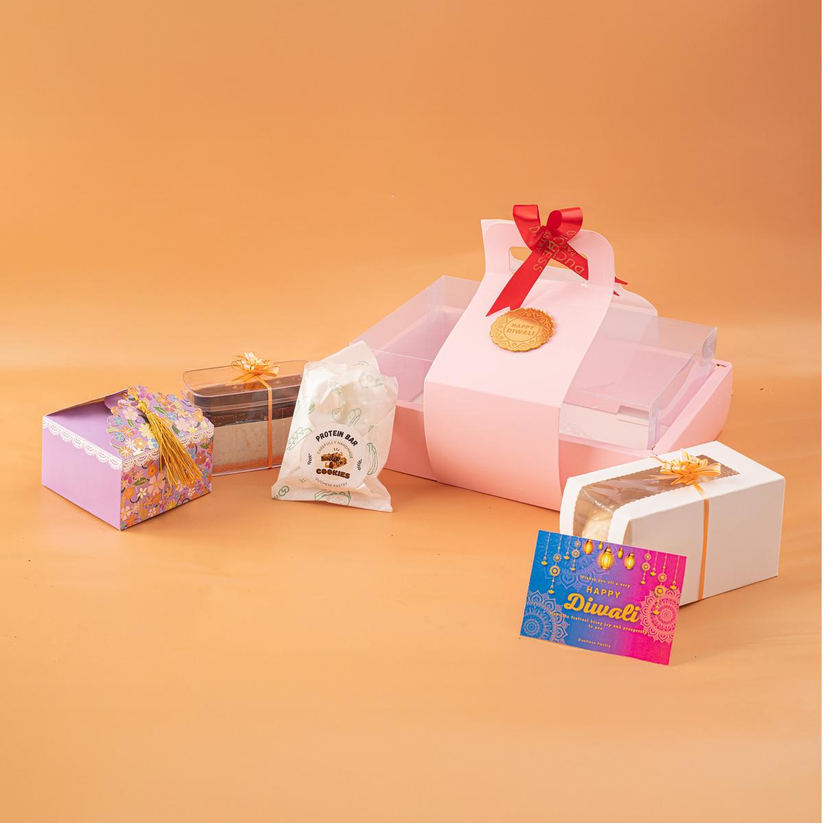 Their Deepavali hampers are a medley of cakes, chocolates, granola bars, and nutri bites Their Deepavali hampers are a medley of cakes, chocolates, granola bars, and nutri bites
