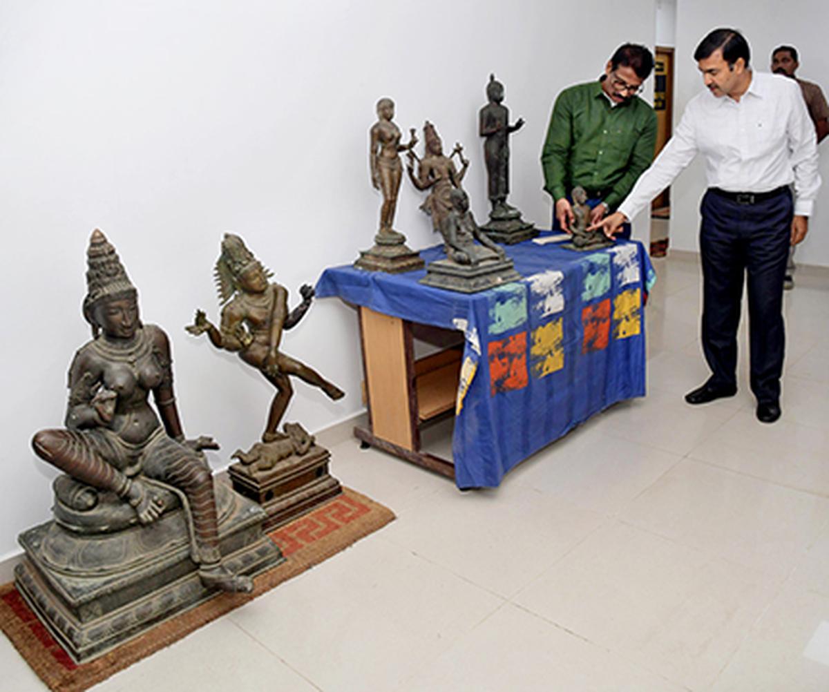 Director General of Police, Idol Wing CID K. Jayanth Murali (left) and Inspector General of Police, R. Dhinakaran inspecting idols seized from Swami Malai
