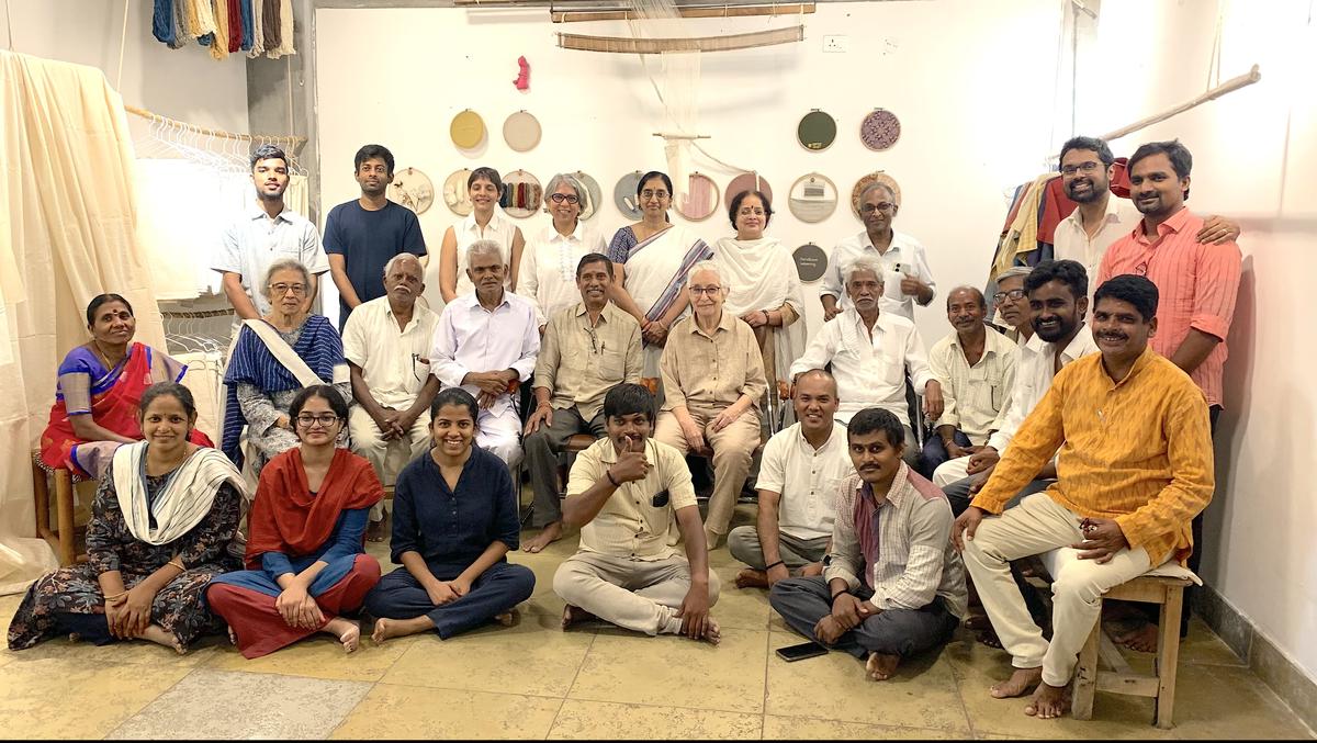 A team of farmers, weavers and spinners of Sonthanga colelction with Uzramma (seated fifth from right) 