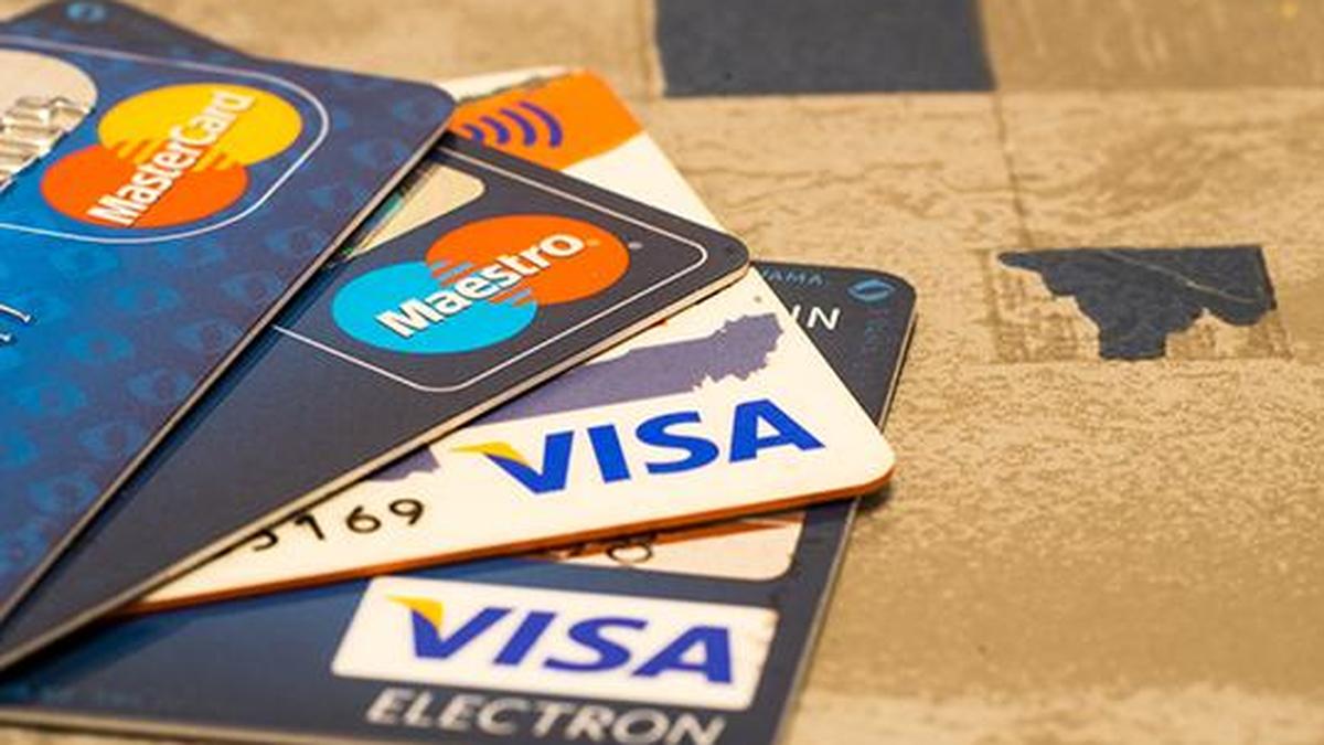 Visa and Mastercard near settlement with merchants, would lower fees: report