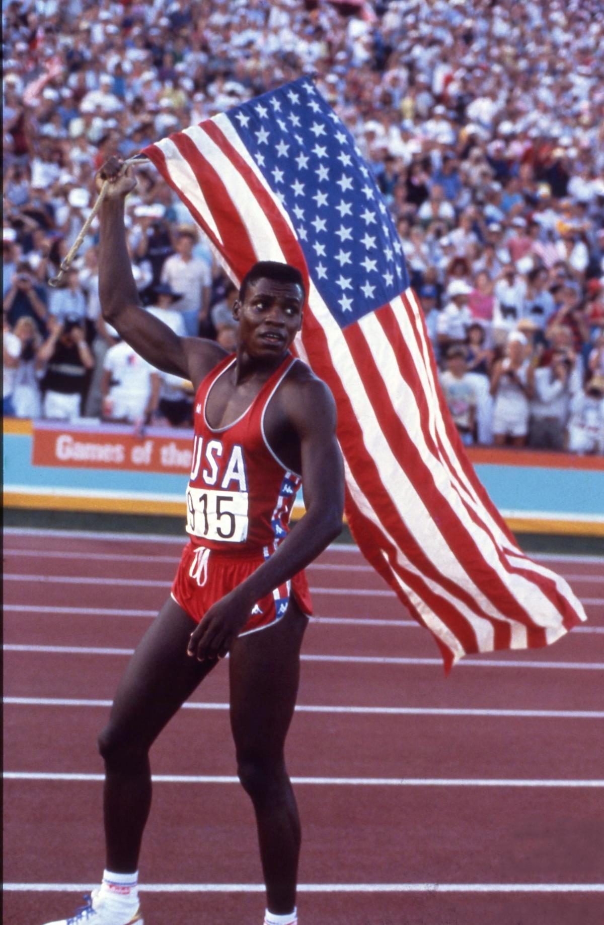 Carl Lewis celebrates with the American flag after winning the gold medal in the 200 meters at the Summer Olympics in Los Angeles on August 04, 1984.
(Published in The Sportstar on January 06, 1990)
PHOTO: ALL SPORT / THE HINDU ARCHIVES Carl Lewis celebrates with the American flag after winning the gold medal in the 200 meters at the Summer Olympics in Los Angeles on August 04, 1984.
(Published in The Sportstar on January 06, 1990)
PHOTO: ALL SPORT / THE HINDU ARCHIVES