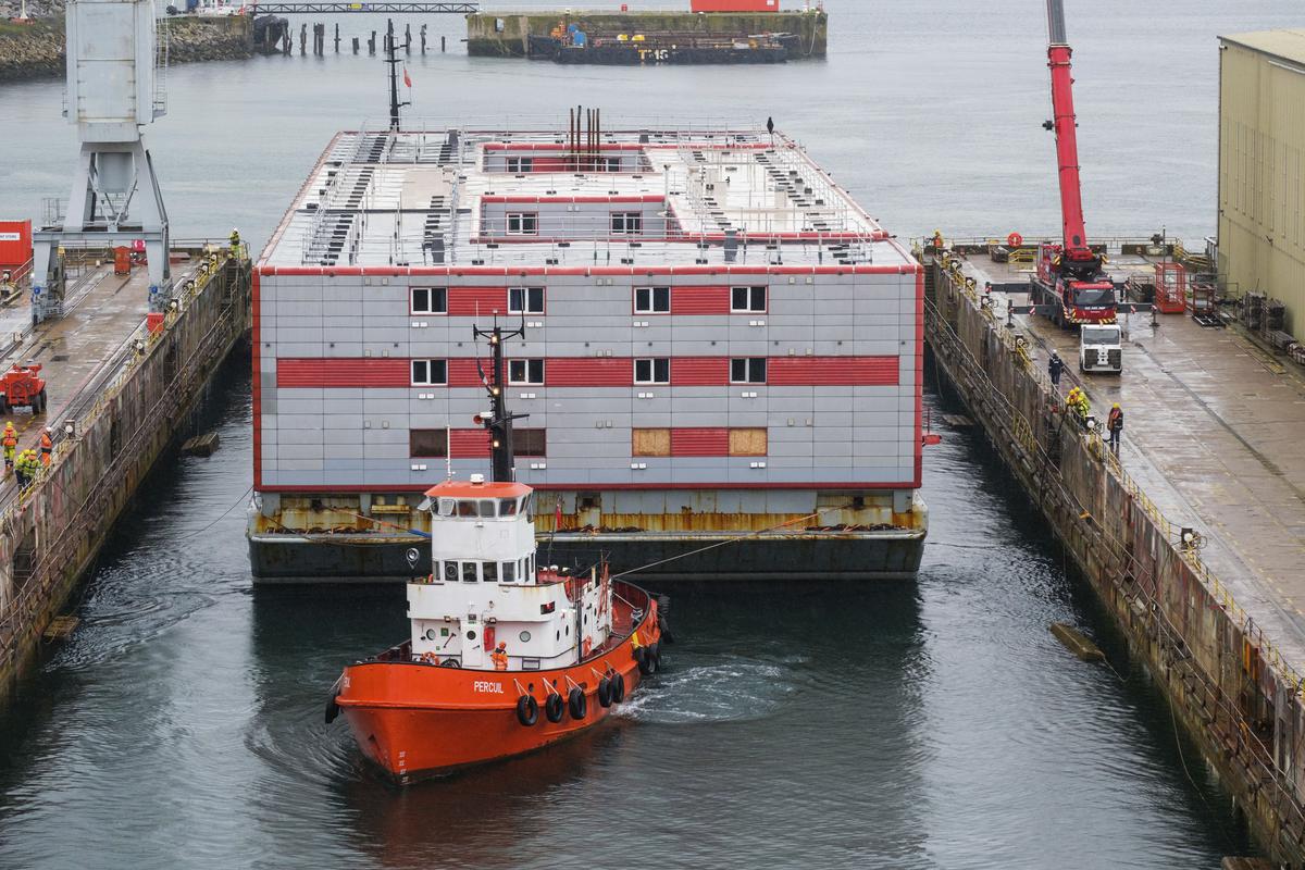 The Bibby Stockholm accommodation barge seen arriving into Falmouth, Cornwall, England, to undergo inspection. The 222-bedroom, three-storey vessel, can house around 500 migrants when it is in position in Portland Port.