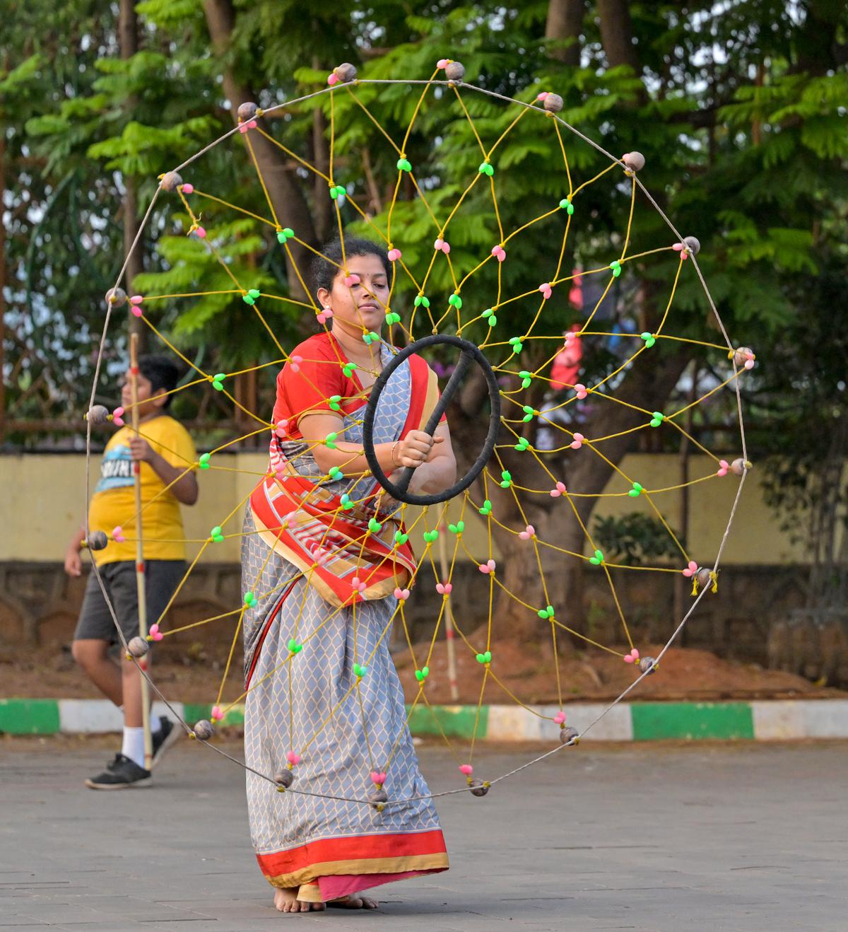 A girl practicing the traditional martial arts of Gatka, which has its roots in Punjab, at a training centre VMRDA Central Park, Visakhapatnam. 