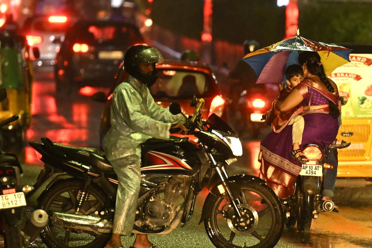 Commuters caught in heavy rain in Hyderabad on Saturday. Commuters caught in heavy rain in Hyderabad on Saturday.
