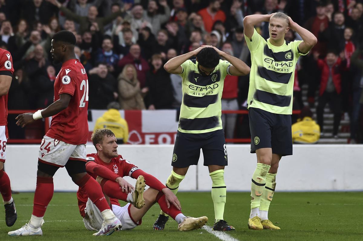 Manchester City’s Ilkay Gundogan, second right, and Manchester City’s Erling Haaland, right, react after missing a scoring chance during the English Premier League football match between Nottingham Forest and Manchester City at City ground in Nottingham, England, Saturday, Feb. 18, 2023. 