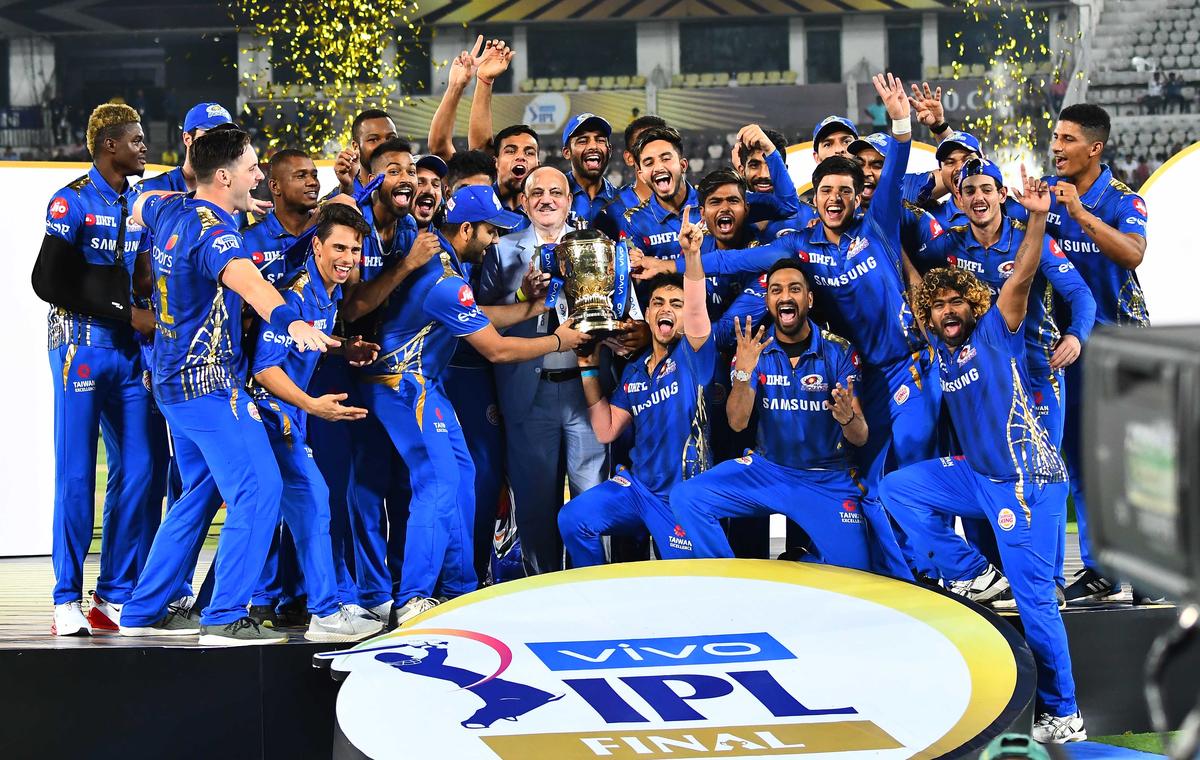 The victorious Mumbai Indians team celebrates with the trophy after winning the VIVO Indian Premier League (IPL) 2019 Twenty20 Championship cricket tournament, beating Chennai Super Kings in the final at the Rajiv Gandhi International Cricket Stadium in Hyderabad on May 12, 2019.  