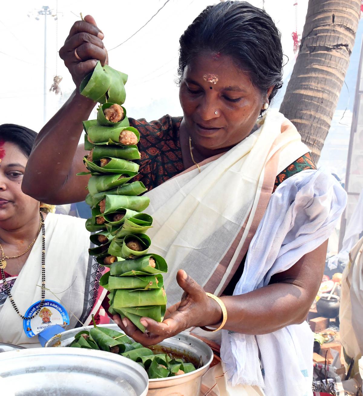 A Devotee making special offerings  during the annual Attukal Pongala festival , in Thiruvananthapuram on Tuesday.
 