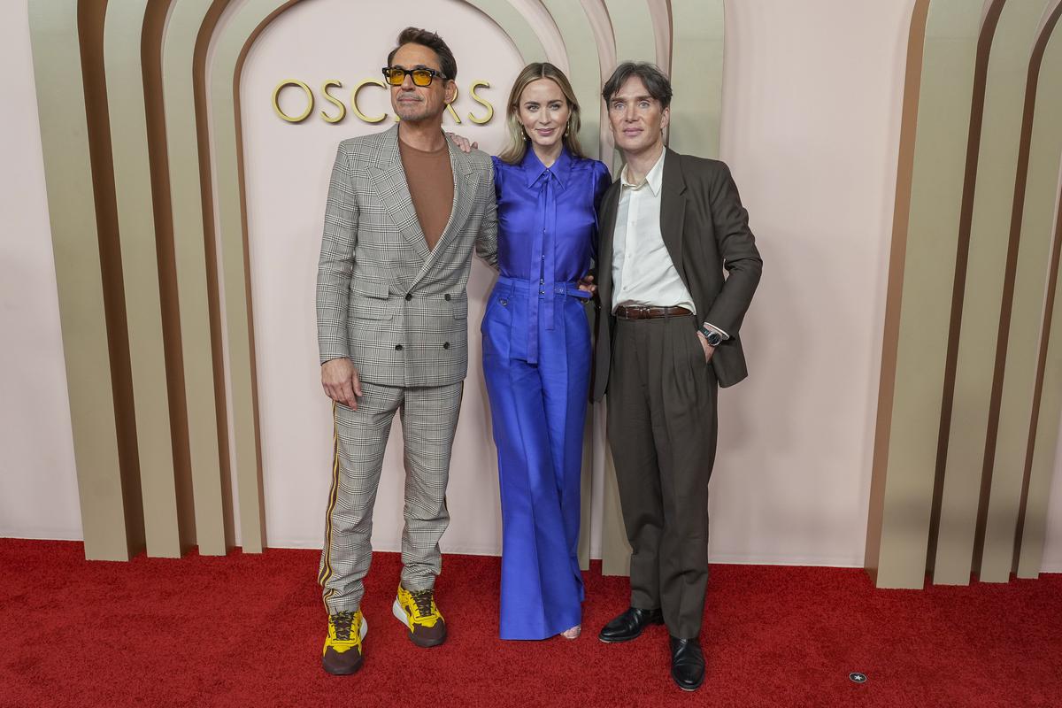 Robert Downey Jr, from left, Emily Blunt and Cillian Murphy, arrives at the 96th Academy Awards Oscar nominees luncheon 