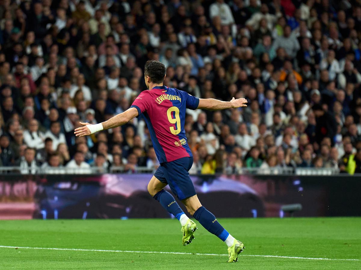 MADRID, SPAIN - OCTOBER 26: Robert Lewandowski of FC Barcelona celebrates after scoring his team's first goal during the LaLiga match between Real Madrid CF and FC Barcelona at Estadio Santiago Bernabeu on October 26, 2024 in Madrid, Spain. (Photo by Angel Martinez/Getty Images)