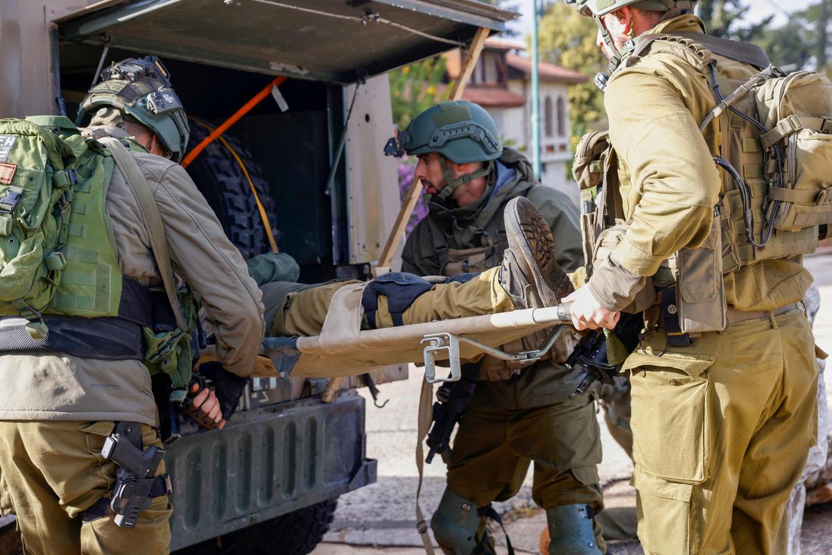 Israeli soldiers take part in military rescue exercise in Upper Galilee near the Lebanon border on January 11, 2024, amid ongoing battles between Israel and Palestinian Hamas militants in the Gaza Strip. 