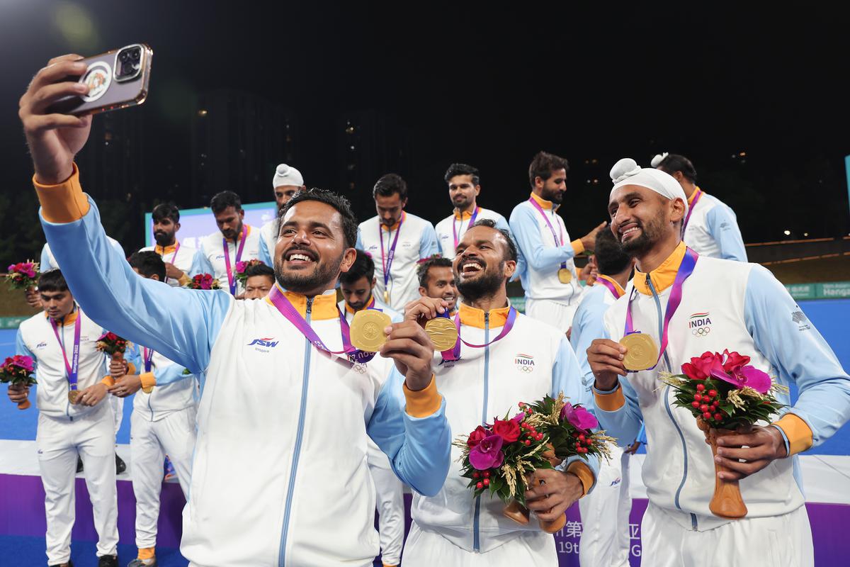 Indian hockey players pose with their gold Medals after the men’s final against Japan at the Hangzhou Asian Games, on October 6, 2023.