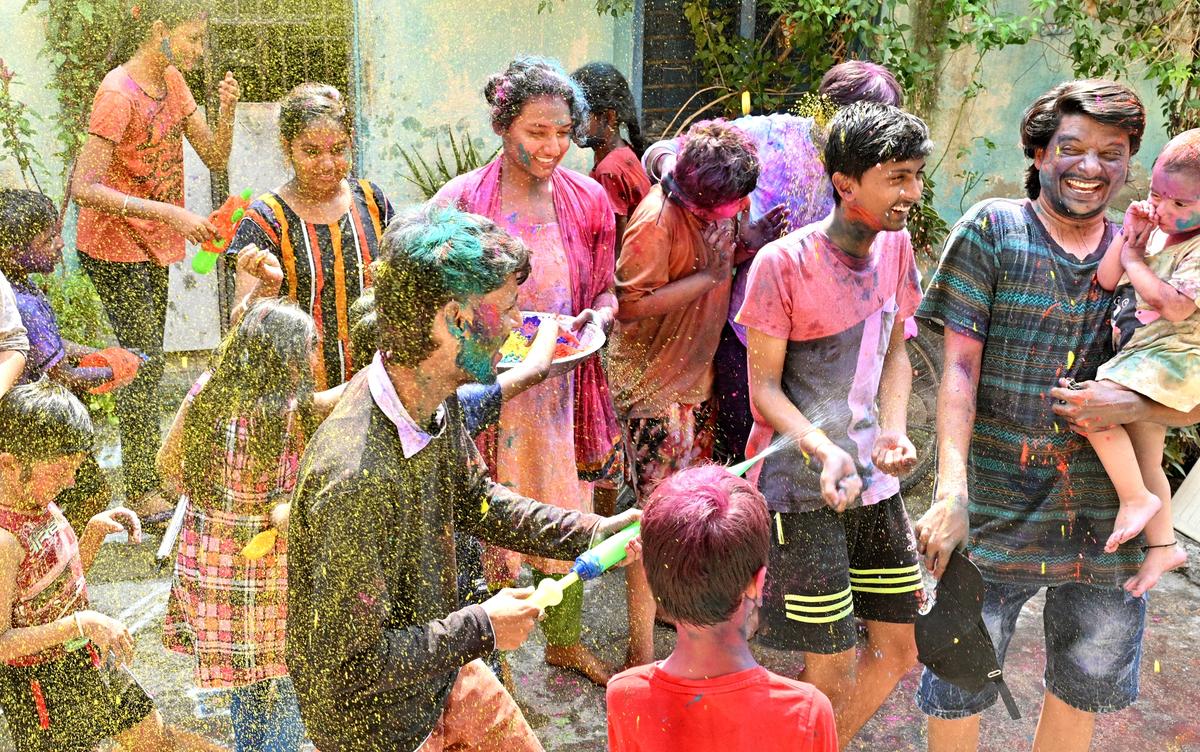 Residents of Tirupati playing Holi on Monday.