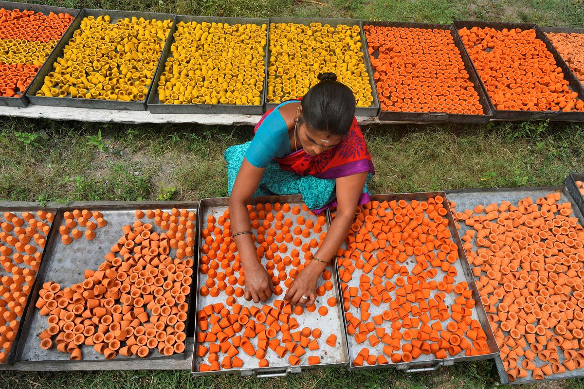 A. Baby, drying coloured sambrani cups at the couple’s manufacturing unit in Avadaiyarpattu, which now employs six persons 