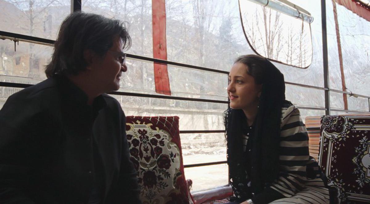 Iranian filmmaker Jafar Panahi (left) in conversation with actor Aida Mohammadkhani in Indian filmmaker Sreemoyee Singh’s documentary ‘And, Towards Happy Alleys’.