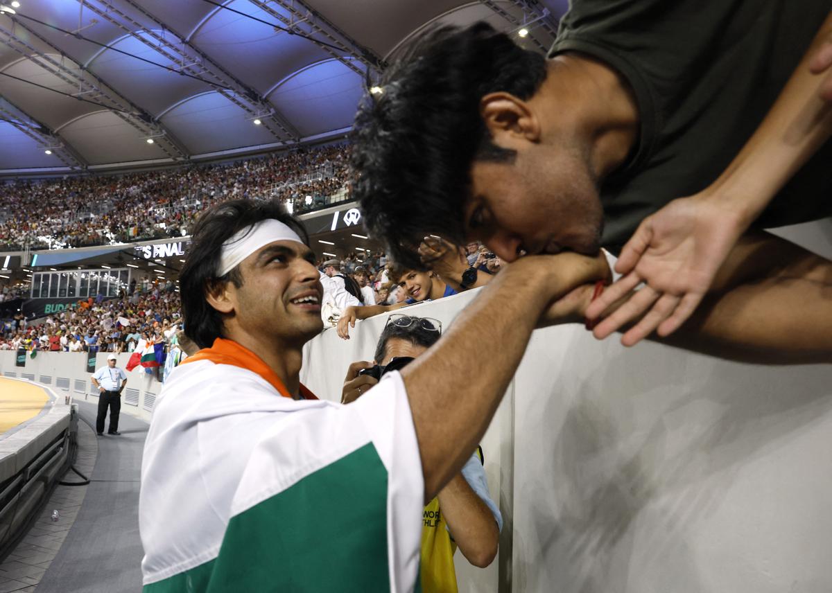 Fans greet Neeraj Chopra after he won the gold in men’s javelin throw at the World Athletics Championships in Budapest.