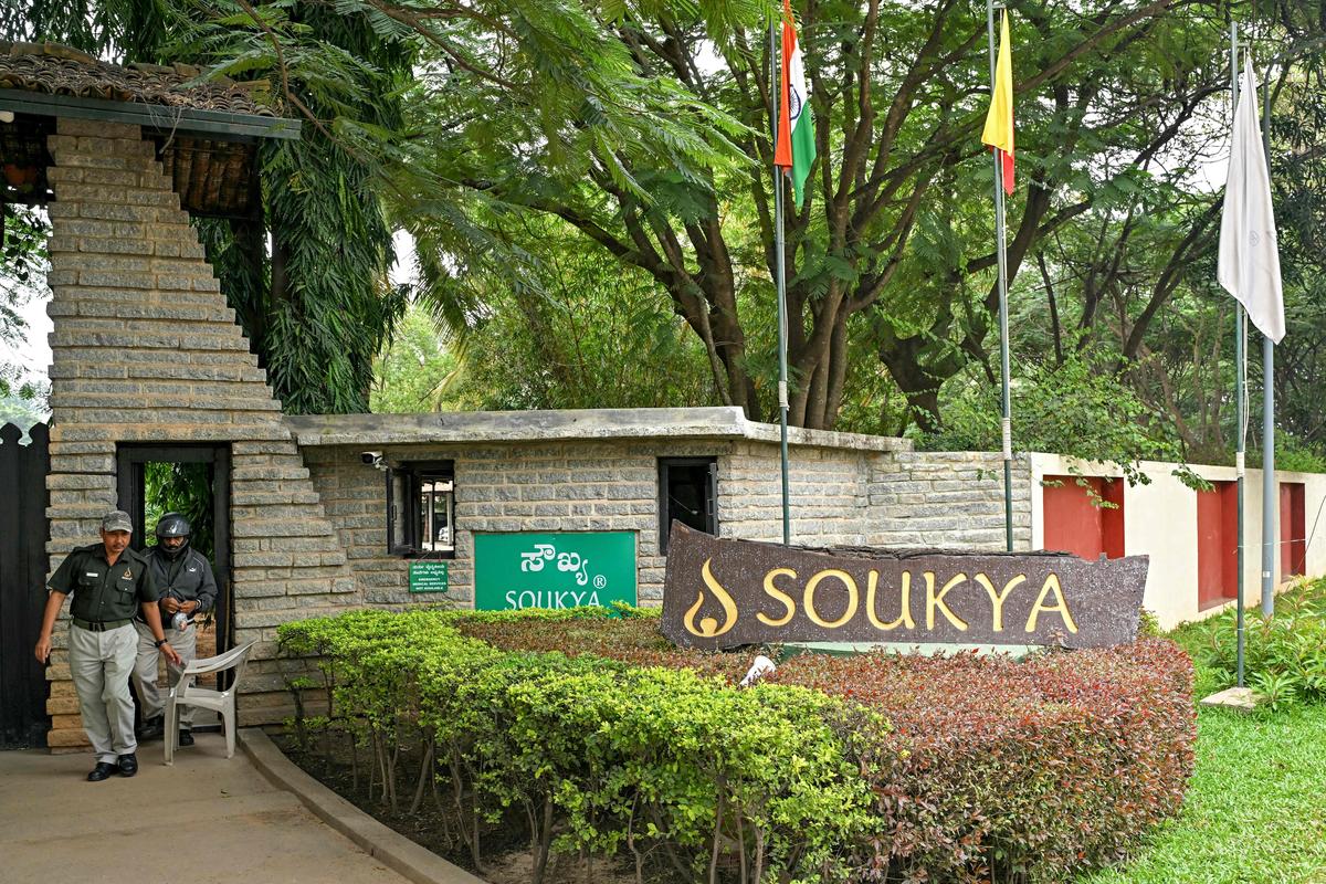 Security personnel stand guard outside the Soukya International Holistic Health Centre (SIHHC) in Bengaluru on October 30, 2024, where King Charles III of Britain and Queen Camilla received wellness treatment. (Photo by Idrees MOHAMMED / AFP)